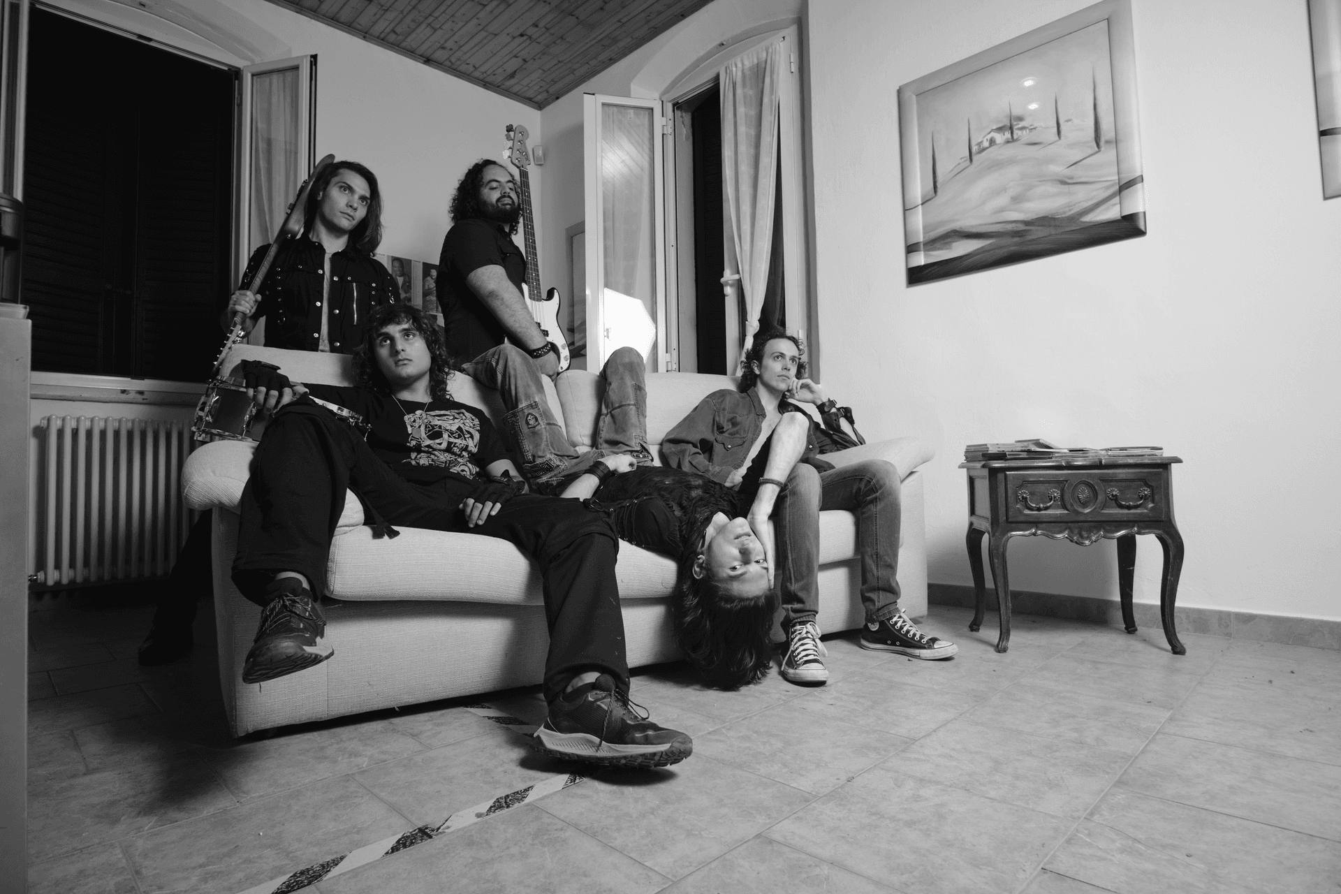 Consequence band members sitting together